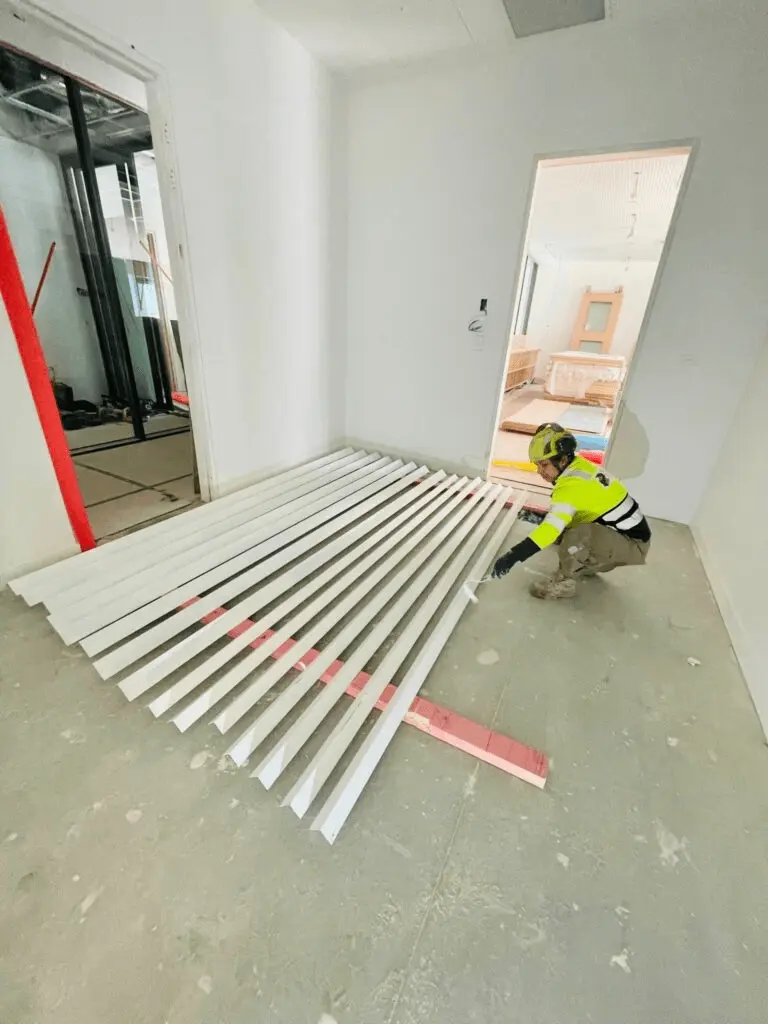 Worker painting boards