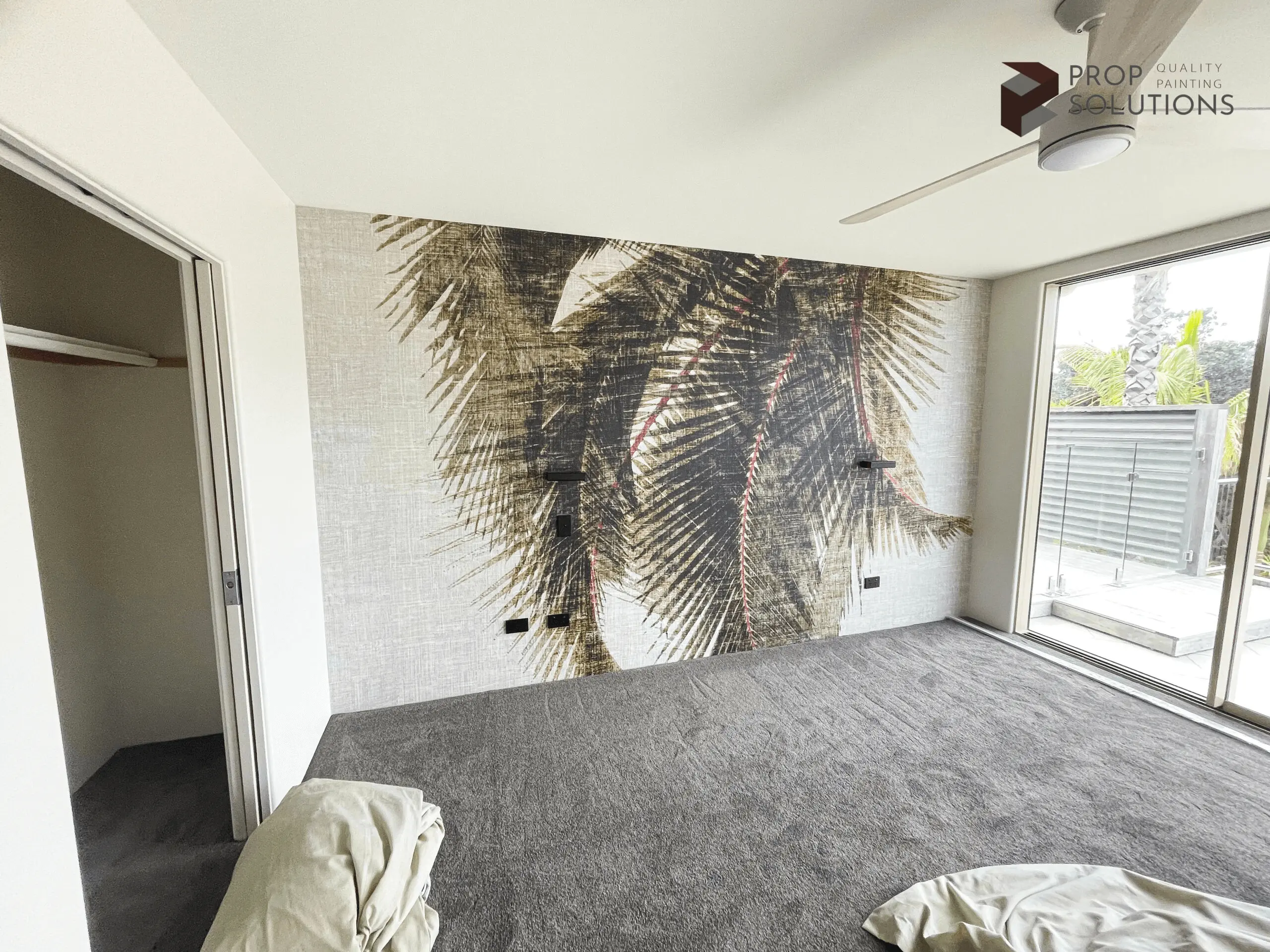 wall with palm tree wallpaper